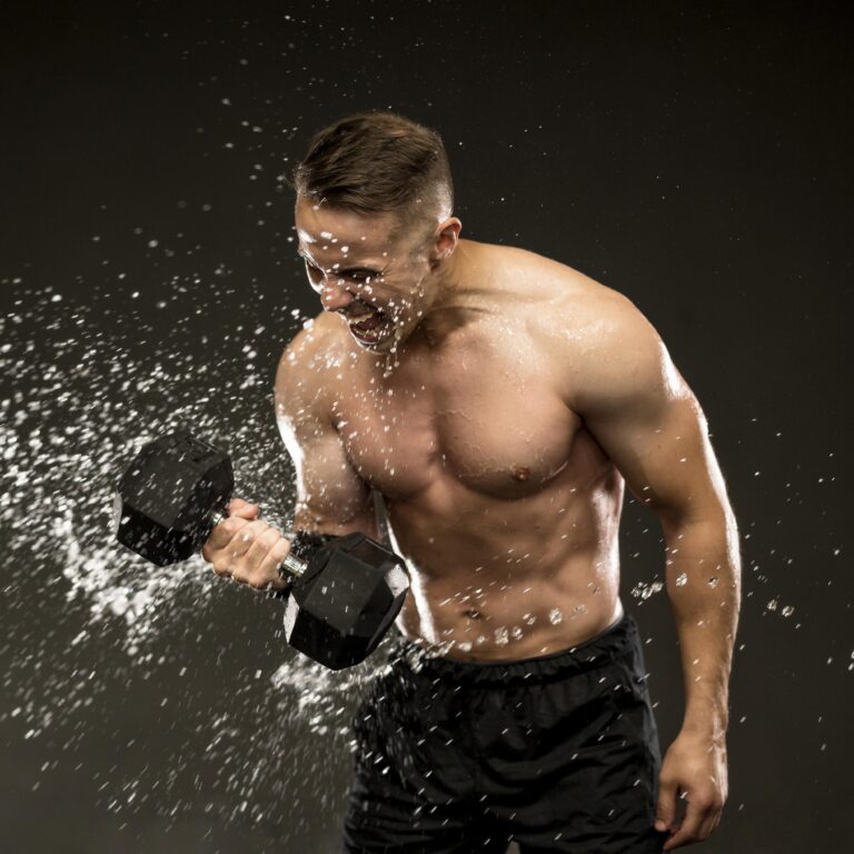 A person drinking water after a workout, surrounded by fitness equipment.